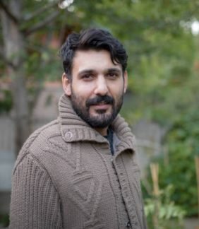 outdoor portrait of syrian male looking